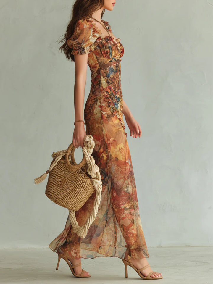 Aria - Lange oranje chiffon jurk met bohemian-stijl olieverfschilderijprint